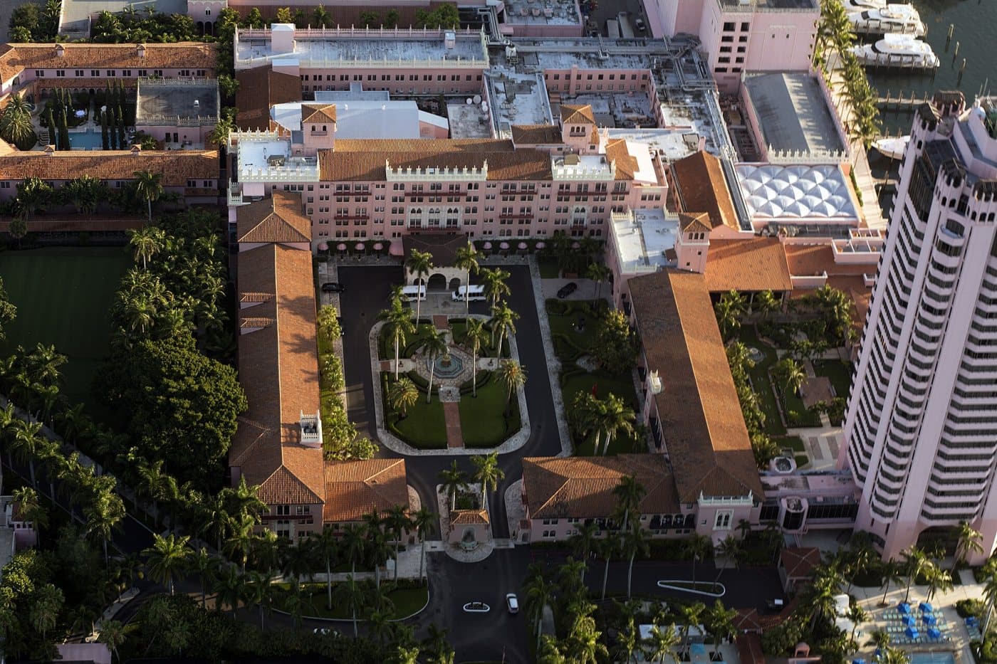 Aerial view of the pink Mediterranean-style Boca Raton Resort and its courtyard