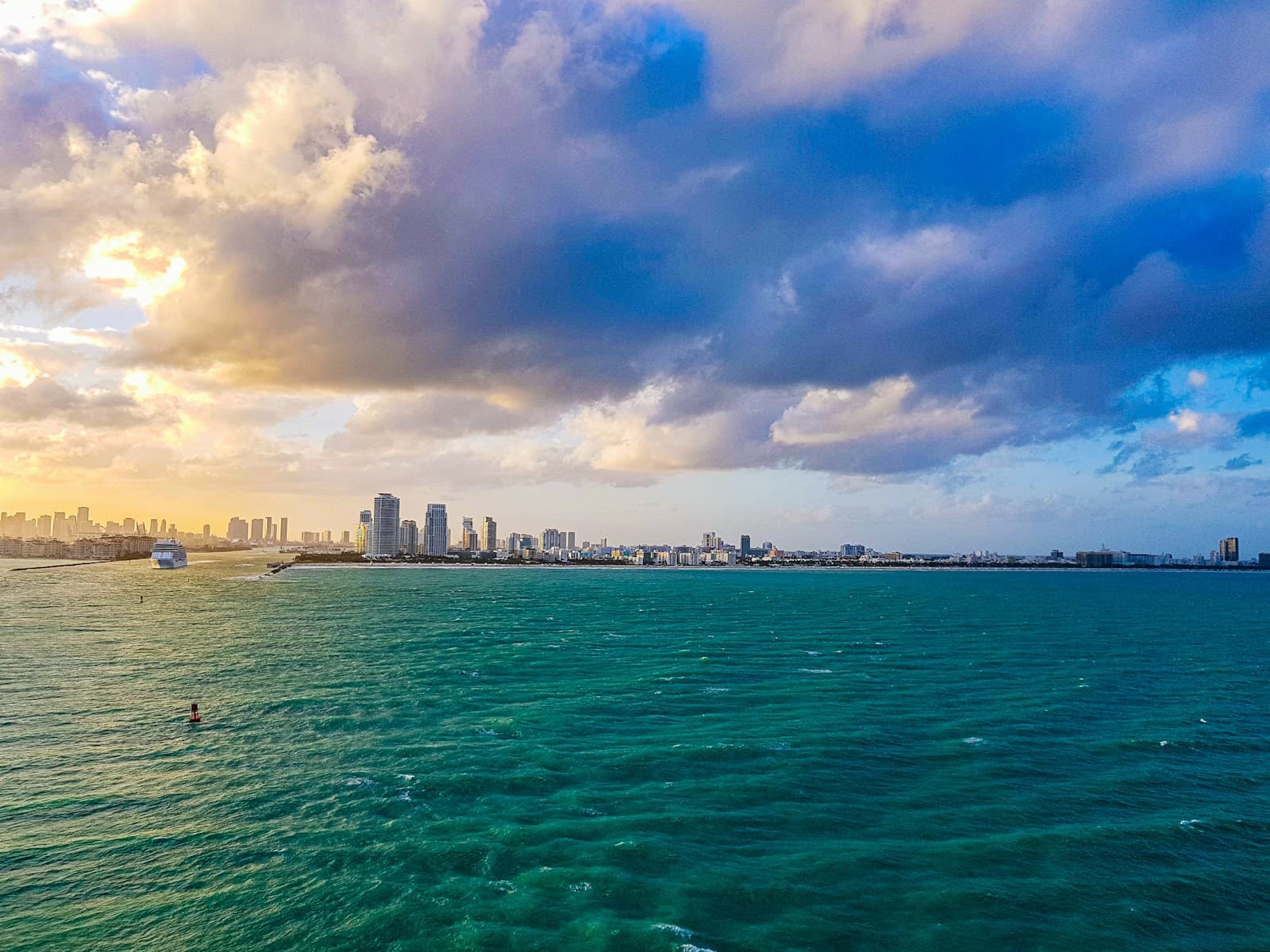 Miami Beach skyline over turquoise water at sunset