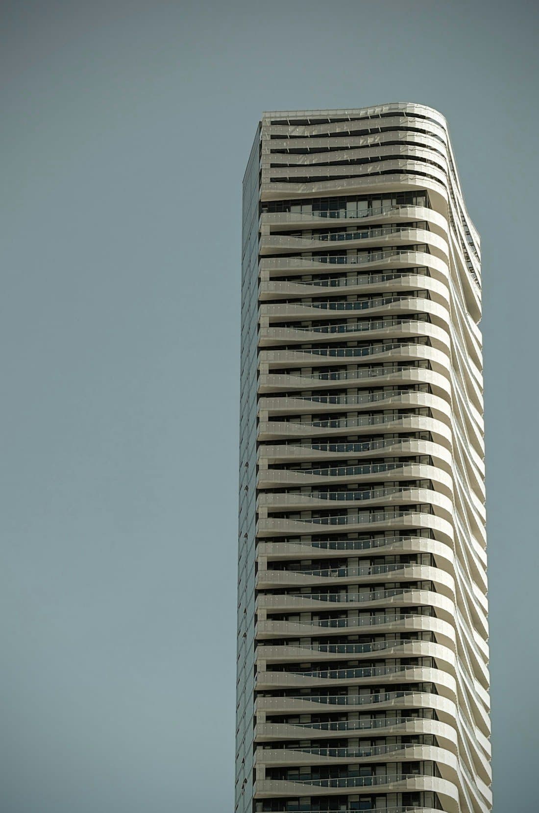 Modern apartment tower with curved balconies